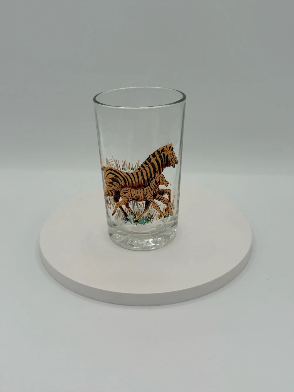 Set of five vintage Pasari glass tumblers with African wildlife decals.